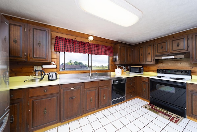 1890 Kaiao St, Hilo, HI 96720 - kitchen with black appliances, under cabinet range hood, a sink, and light countertops