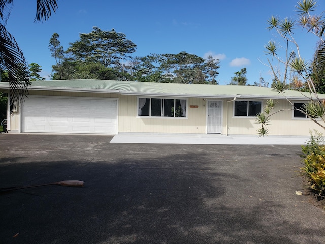 15-1826 32nd Ave, Keaau, HI 96749 - single story home with an attached garage, driveway, and metal roof