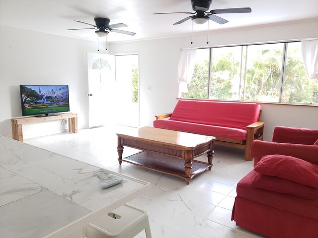 15-1826 32nd Ave, Keaau, HI 96749 - living area with ceiling fan, healthy amount of natural light, and marble look tiles