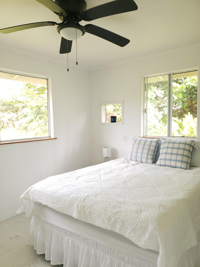 15-1826 32nd Ave, Keaau, HI 96749 - bedroom with multiple windows, ornamental molding, marble look tiles, and ceiling fan