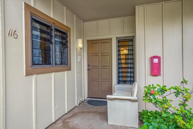 4460 Nehe Rd Unit 116, Lihue, HI 96766 - doorway to property featuring board and batten siding and covered porch