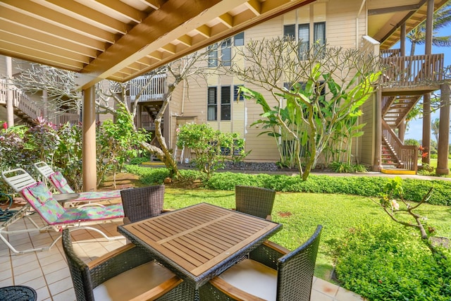 4460 Nehe Rd Unit 116, Lihue, HI 96766 - view of patio featuring stairway and outdoor dining area