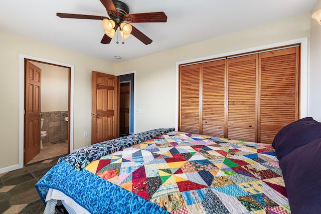 92-8227 Trade Wind Blvd, Ocean View, HI 96737 - bedroom with a closet, connected bathroom, ceiling fan, and tile walls