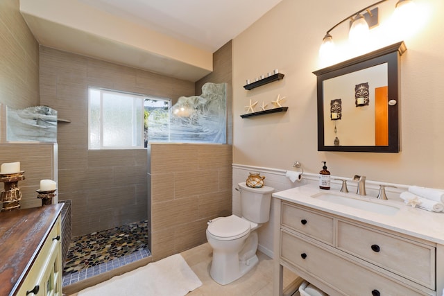 83-5672 Kanele St, Captain Cook, HI 96704 - bathroom featuring vanity, tile walls, toilet, a walk in shower, and tile patterned flooring