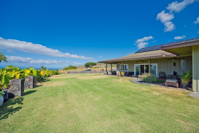 83-5672 Kanele St, Captain Cook, HI 96704 - view of green lawn with ceiling fan, a patio area, and an outdoor hangout area