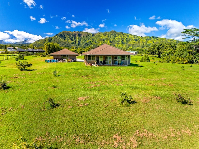 6421-L Hauiki Rd, Kapaa, HI 96746 - view of front facade featuring a mountain view and a front lawn