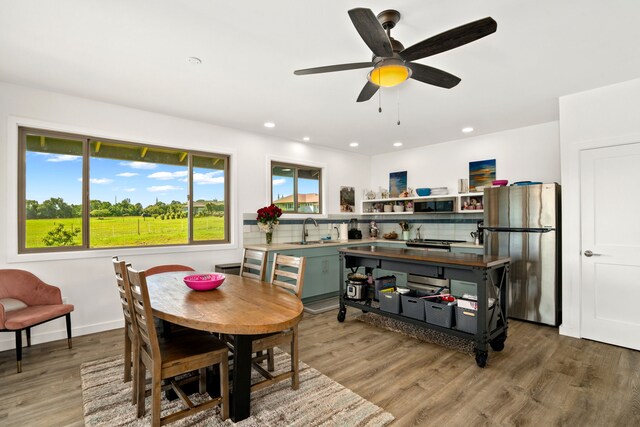 6421-L Hauiki Rd, Kapaa, HI 96746 - dining space featuring wood finished floors, recessed lighting, a ceiling fan, and baseboards