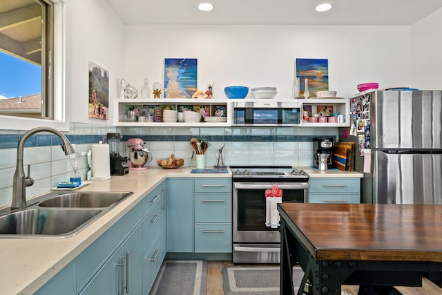 6421-L Hauiki Rd, Kapaa, HI 96746 - kitchen featuring appliances with stainless steel finishes, a sink, open shelves, tasteful backsplash, and recessed lighting