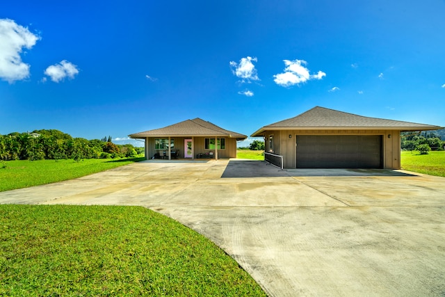 6421-L Hauiki Rd, Kapaa, HI 96746 - ranch-style house with driveway, a front yard, board and batten siding, and a garage