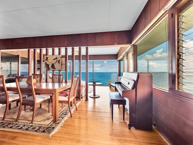 224 Paukaa Dr, Hilo, HI 96720 - dining area featuring light wood-type flooring, wood walls, and a water view
