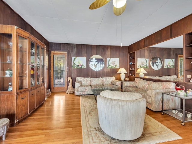 224 Paukaa Dr, Hilo, HI 96720 - living room featuring wooden walls, light wood-style floors, and a ceiling fan