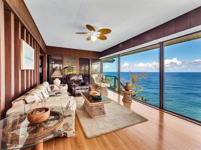 224 Paukaa Dr, Hilo, HI 96720 - sunroom featuring wood finished floors and a water view