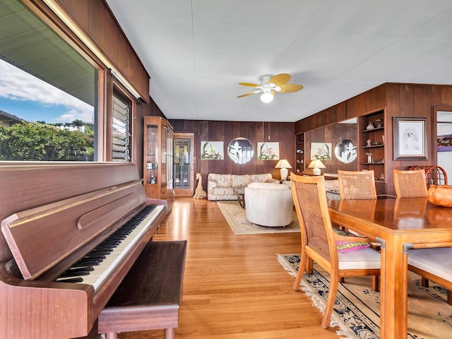 224 Paukaa Dr, Hilo, HI 96720 - dining area featuring wood walls, a ceiling fan, and light wood finished floors