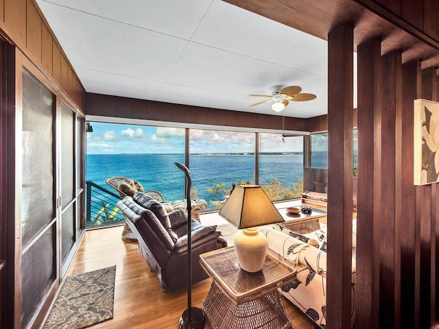 224 Paukaa Dr, Hilo, HI 96720 - sunroom with wood finished floors, wood walls, and a water view