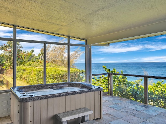224 Paukaa Dr, Hilo, HI 96720 - sunroom featuring a hot tub, a water view, and plenty of natural light