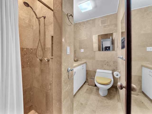 224 Paukaa Dr, Hilo, HI 96720 - bathroom with tile walls, a tile shower, and vanity