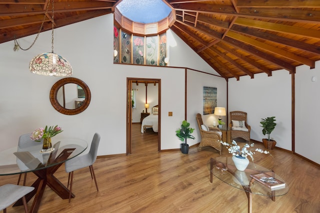19-4235 Wright Rd, Volcano, HI 96785 - living room with wooden ceiling with exposed beams, light wood finished floors, baseboards, and high vaulted ceiling