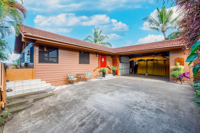 73-1291 Kaiminani Dr, Kailua-Kona, HI 96740 - ranch-style home with a tiled roof and concrete driveway
