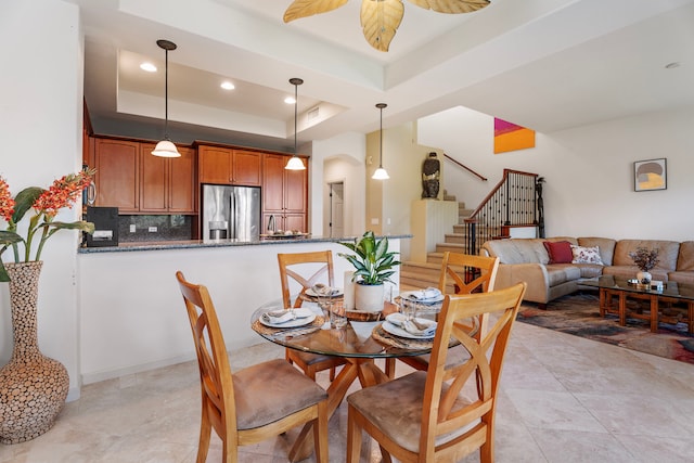 68-1125 Kaniku Dr Unit 1103, Kamuela, HI 96743 - dining space featuring stairway, a raised ceiling, a ceiling fan, arched walkways, and recessed lighting