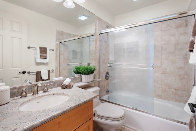 68-1125 Kaniku Dr Unit 1103, Kamuela, HI 96743 - bathroom featuring vanity, toilet, and combined bath / shower with glass door