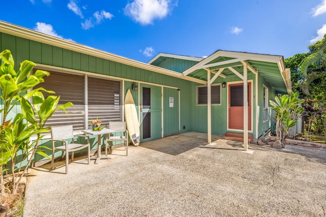 384-A Kaholalele Rd Unit B, Kapaa, HI 96746 - rear view of property featuring entry steps and a patio area