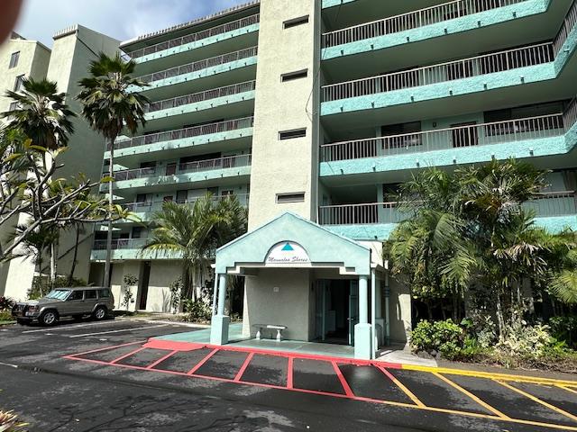 1875 Kalanianaole St Unit 209, Hilo, HI 96720 - view of apartment building / complex featuring uncovered parking