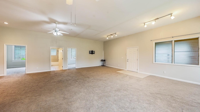 4460 Punee Rd Unit A, Koloa, HI 96756 - unfurnished room featuring a ceiling fan, carpet floors, rail lighting, and baseboards