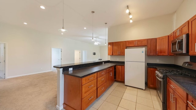 4460 Punee Rd Unit A, Koloa, HI 96756 - kitchen with stainless steel appliances, a peninsula, brown cabinetry, and recessed lighting