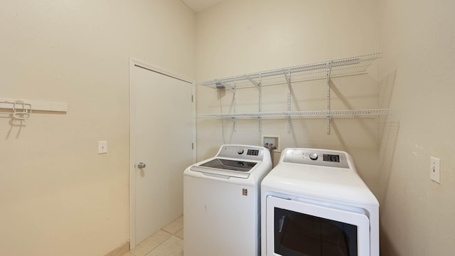 4460 Punee Rd Unit A, Koloa, HI 96756 - laundry room featuring washer and dryer, light tile patterned floors, and baseboards