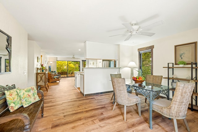 2721 Poipu Rd Unit 100, Koloa, HI 96756 - dining area with ceiling fan and light wood-type flooring