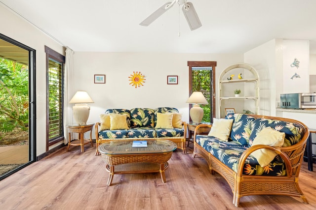 2721 Poipu Rd Unit 100, Koloa, HI 96756 - living room featuring wood finished floors and a ceiling fan