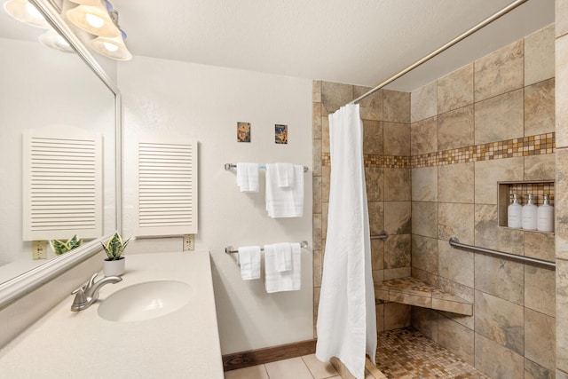 2721 Poipu Rd Unit 100, Koloa, HI 96756 - full bathroom featuring tiled shower, vanity, and tile patterned floors