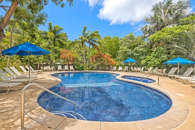 2721 Poipu Rd Unit 100, Koloa, HI 96756 - community pool with a community hot tub, a patio area, and view of scattered trees