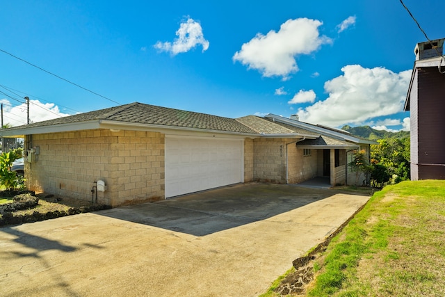 4879 Lani Rd, Kapaa, HI 96746 - view of front of property featuring a garage, driveway, and a shingled roof