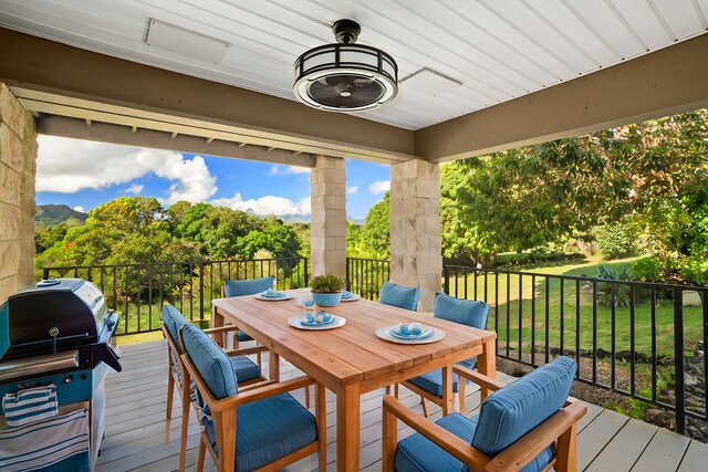 4879 Lani Rd, Kapaa, HI 96746 - wooden terrace with area for grilling, outdoor dining area, and a lawn