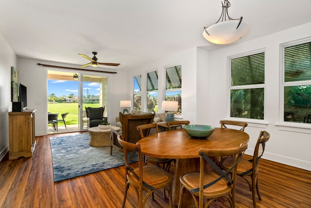 2611 Kiahuna Plantation Dr Unit 6M, Koloa, HI 96756 - dining room with dark wood-style flooring, ceiling fan, and baseboards