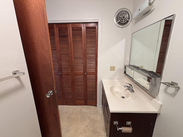 33 Hualalai St Unit 203, Hilo, HI 96720 - bathroom featuring a closet and vanity