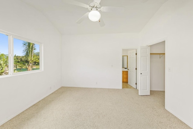 15-1765 23rd Ave, Keaau, HI 96749 - unfurnished bedroom with vaulted ceiling, light carpet, a closet, a ceiling fan, and connected bathroom