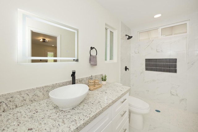 15-1042 Amau Rd, Keaau, HI 96749 - full bathroom featuring vanity, a marble finish shower, toilet, recessed lighting, and marble finish flooring