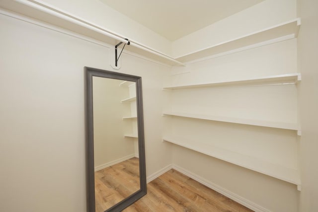 15-1042 Amau Rd, Keaau, HI 96749 - walk in closet with wood finished floors
