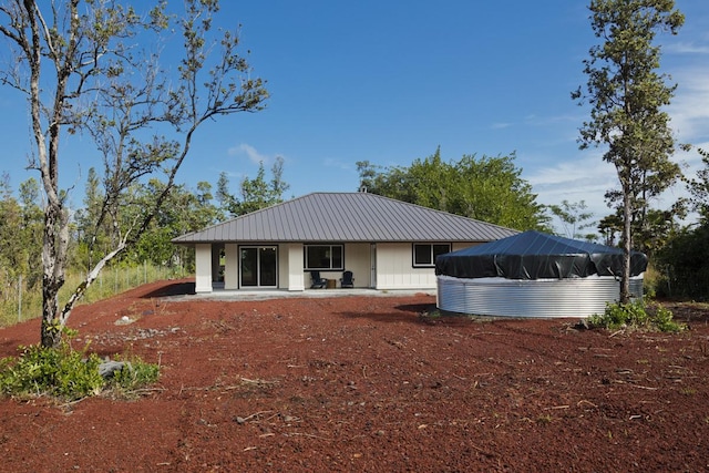 15-1042 Amau Rd, Keaau, HI 96749 - rear view of property with metal roof