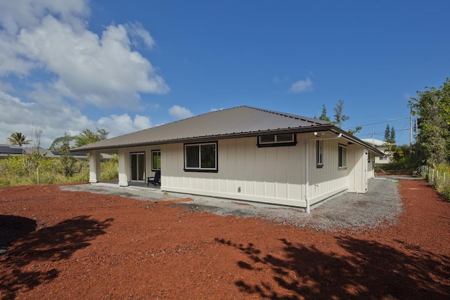 15-1042 Amau Rd, Keaau, HI 96749 - rear view of house featuring a patio and metal roof