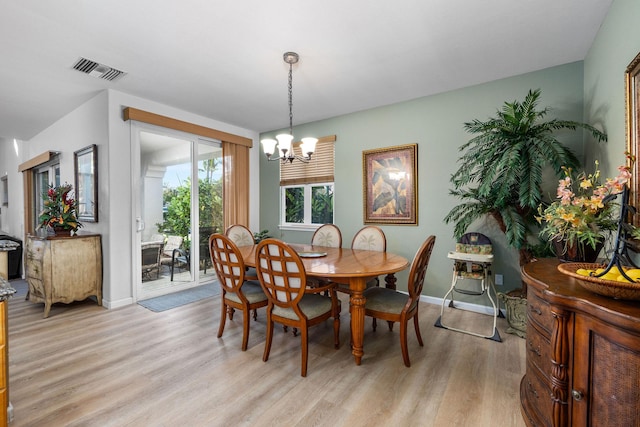 69-555 Waikoloa Beach Dr Unit 2605, Waikoloa, HI 96738 - dining room featuring light wood-style floors, a chandelier, and baseboards