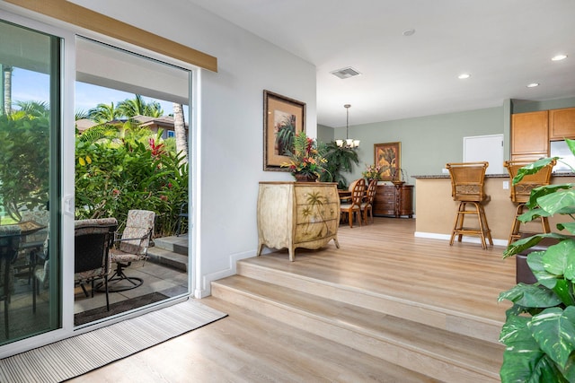 69-555 Waikoloa Beach Dr Unit 2605, Waikoloa, HI 96738 - interior space with light wood finished floors, baseboards, recessed lighting, and a chandelier