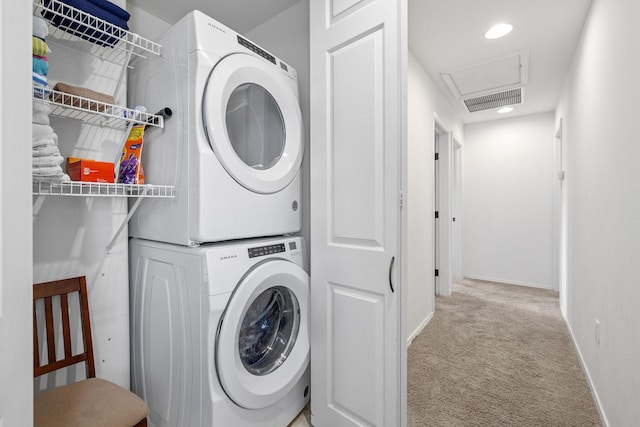 69-555 Waikoloa Beach Dr Unit 2605, Waikoloa, HI 96738 - washroom featuring estacked washer and dryer, carpet floors, attic access, baseboards, and recessed lighting