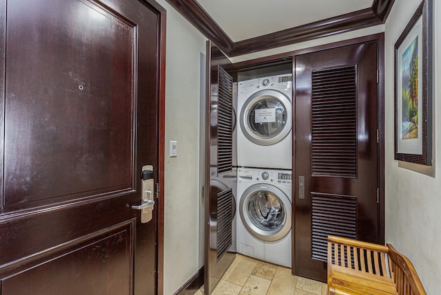 4-820 Kuhio Hwy Unit D207, Kapaa, HI 96746 - laundry room featuring estacked washer and dryer, ornamental molding, and stone tile floors