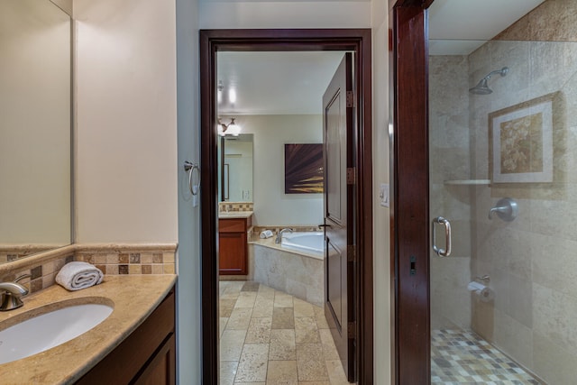 4-820 Kuhio Hwy Unit D207, Kapaa, HI 96746 - full bath with a shower stall, vanity, a bath, stone tile floors, and backsplash