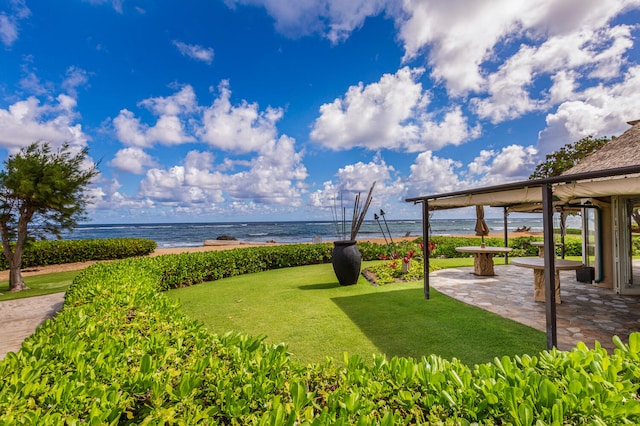 4-820 Kuhio Hwy Unit D207, Kapaa, HI 96746 - view of green lawn with a water view, a gazebo, and a patio area