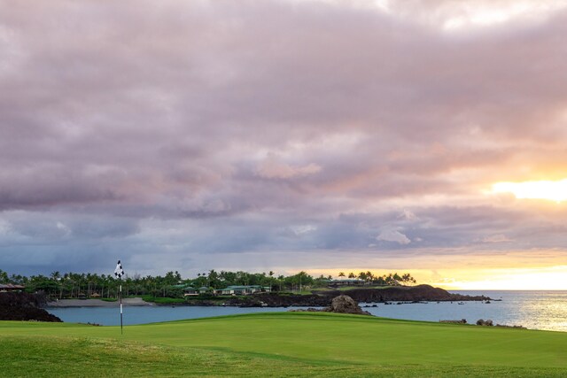 68-1051 Ke Kailani Dr, Kamuela, HI 96743 - view of community with a water view, view of golf course, and a lawn