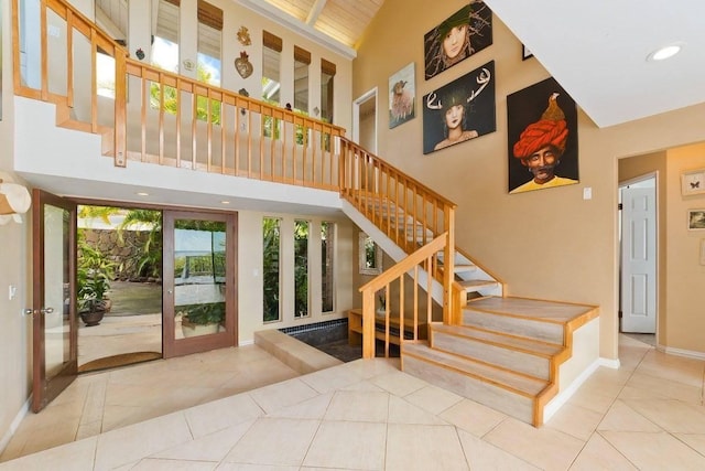 77-172 Kekai Pl, Kailua-Kona, HI 96740 - stairway with tile patterned floors, a towering ceiling, baseboards, and recessed lighting